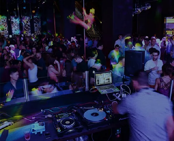 Nightclub scene with DJ and crowd, promoting events on an Asian directory website.